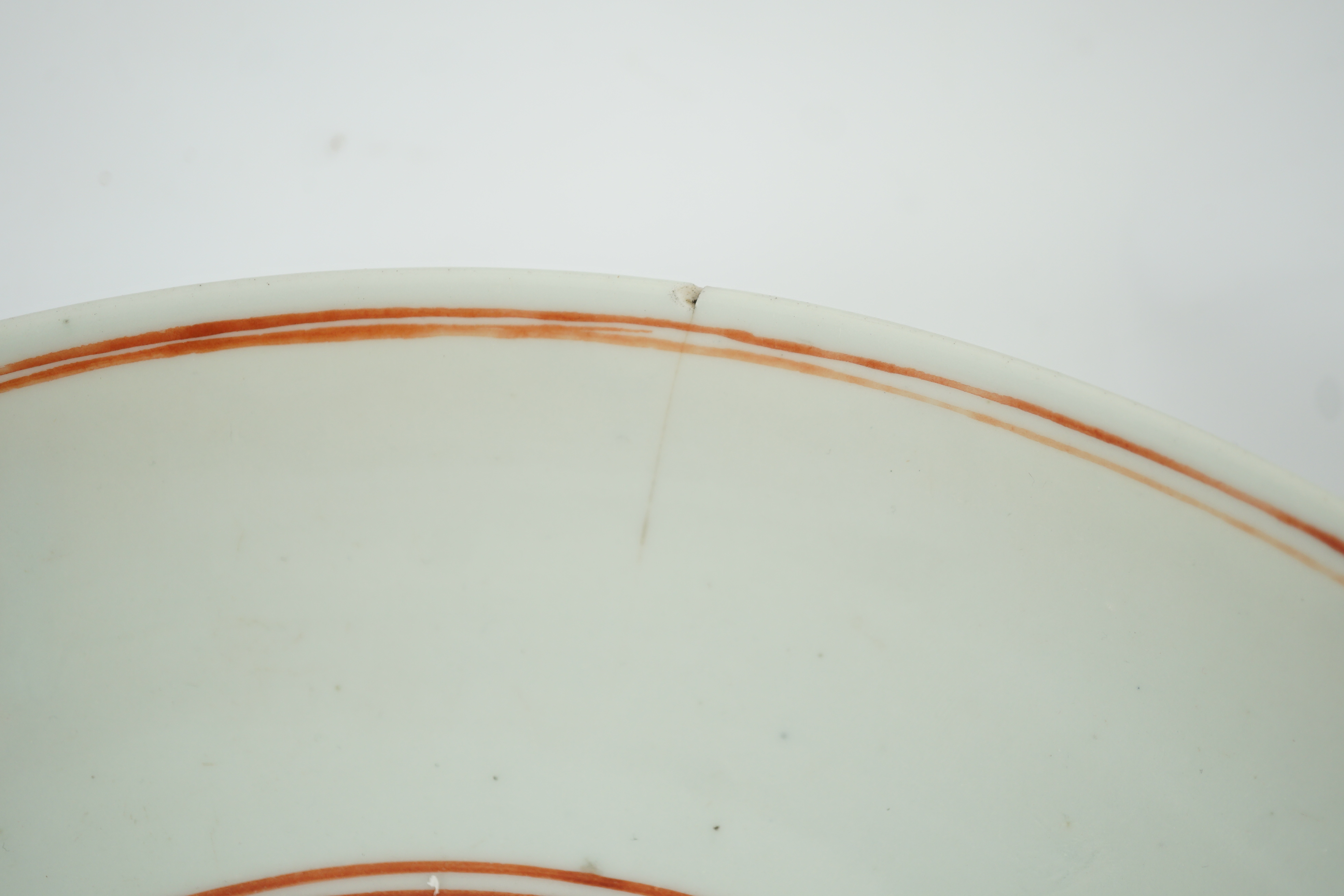 A large Chinese iron red enamelled ‘lotus pond’ dish, Wanli mark and possibly of the period, two short cracks